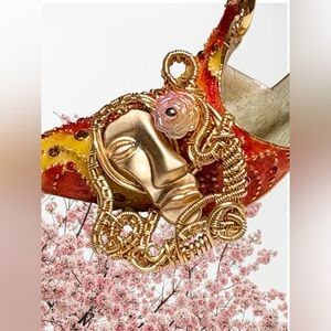 Artistic Gold Wire Wrapped Face Pendant